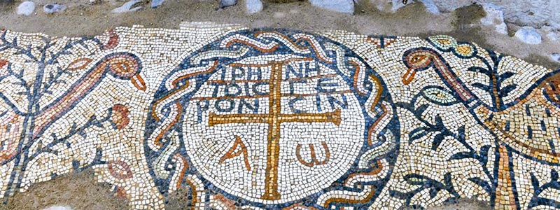 The words “Peace be with the elders,” written in Greek
